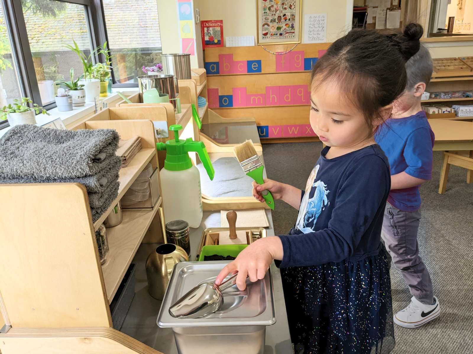 Child working at the Planting Cabinet